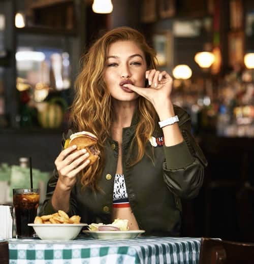 Gigi Hadid eating a burger