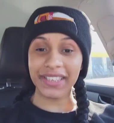 Cardi B wearing a beanie inside car with no makeup