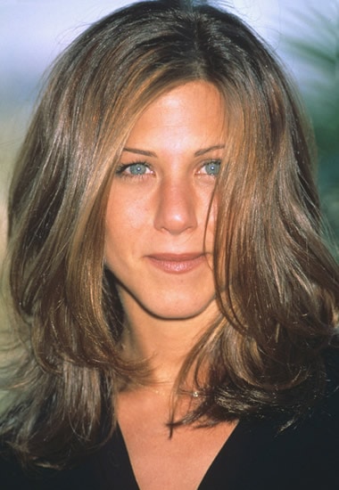 Young Jennifer Aniston with long curls