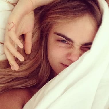 Cara Delevingne waking up in bed