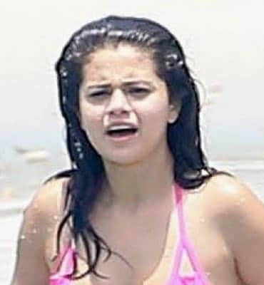 Selena Gomez enjoying the water at the beach with no makeup on