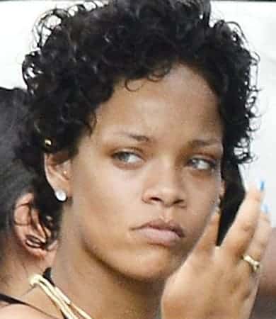 Rihanna with short curly hair and no makeup