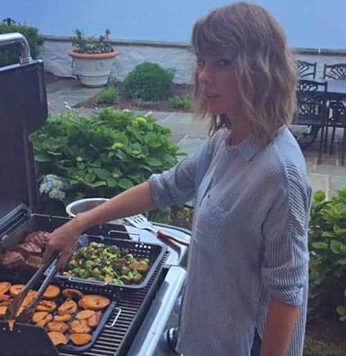 Taylor Swift cooking for guest at her barbecue