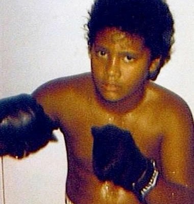 Dwayne Johnson posing as a young boxer