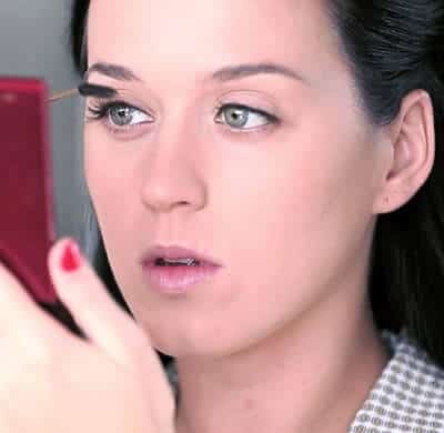 Katy Perry putting makeup on
