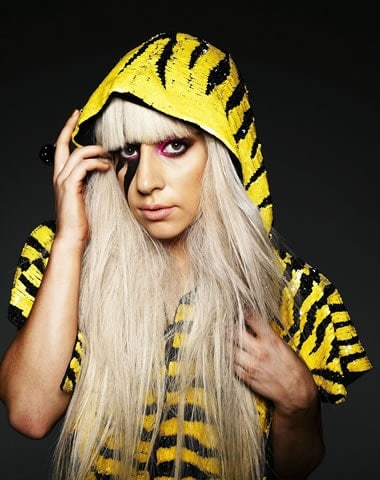 Lady Gaga in a yellow tiger pattern raincoat