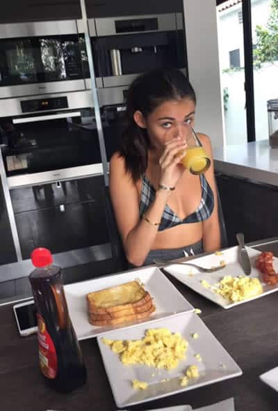 Madison Beer eating bacon and scrambled eggs