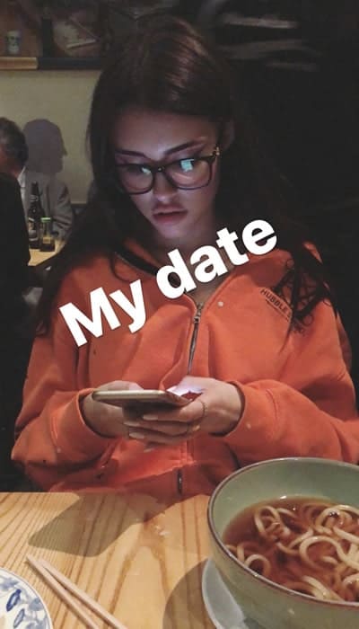 Madison Beer eating noodle on a date