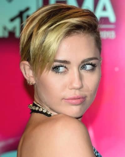 Miley Cyrus signature side-swept fringe hairstyles