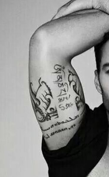 Ricky Martin right inner arm tattoo