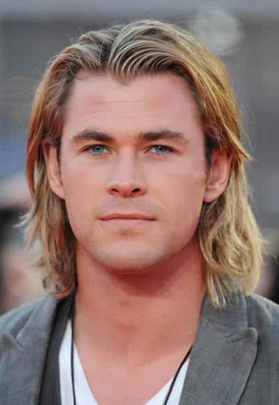 Chris Hemsworth looks like a surfer with those medium-long hair