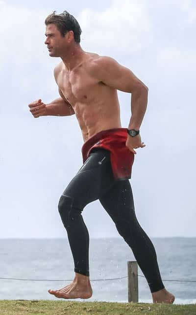 Chris Hemsworth running along the beach