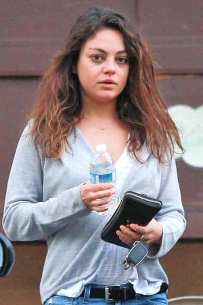 Mila Kunis is staying hydrated by drinking lots of water