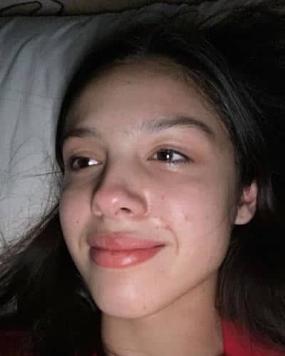 Olivia Rodrigo lying in bed