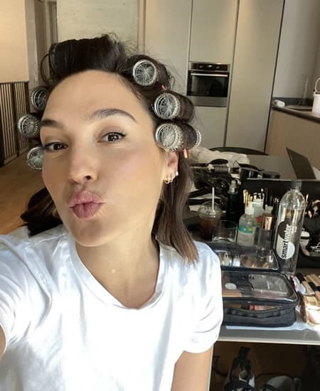 Gal Gadot doing her hair and makeup in the kitchen