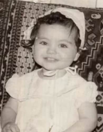 Mila Kunis baby photo with a chubby face