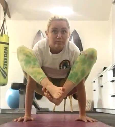 Miley Cyrus yoga walking on her hands