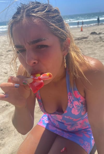 Addison Rae eating ice block at the beach