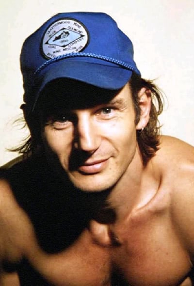 Liam Neeson wearing a baseball cap