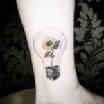 Surrealist Sunflower Tattoo
